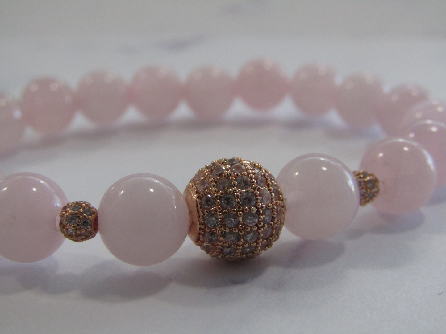 Grade A Rose Quartz bracelet with grade AAA Cubic Zirconia rose gold beads