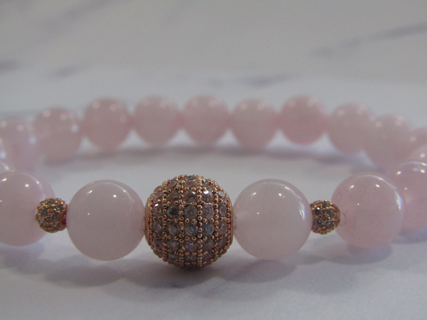 Grade A Rose Quartz bracelet with grade AAA Cubic Zirconia rose gold beads