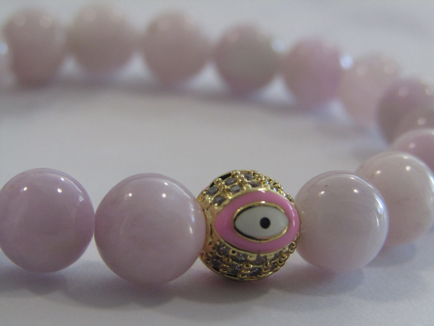 Grade A Kunzite bracelet with 18k gold plated pink evil eye