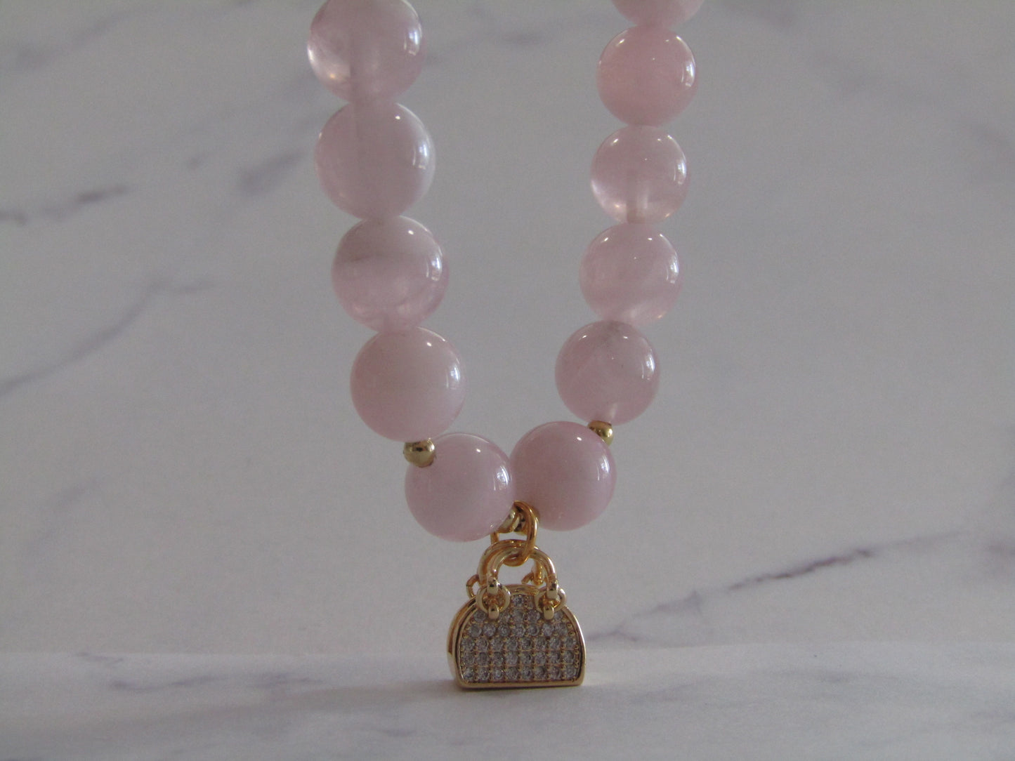 Grade A Madagascar Rose Quartz (8mm) bracelet with 18k gold plated Cubic Zirconia handbag charm