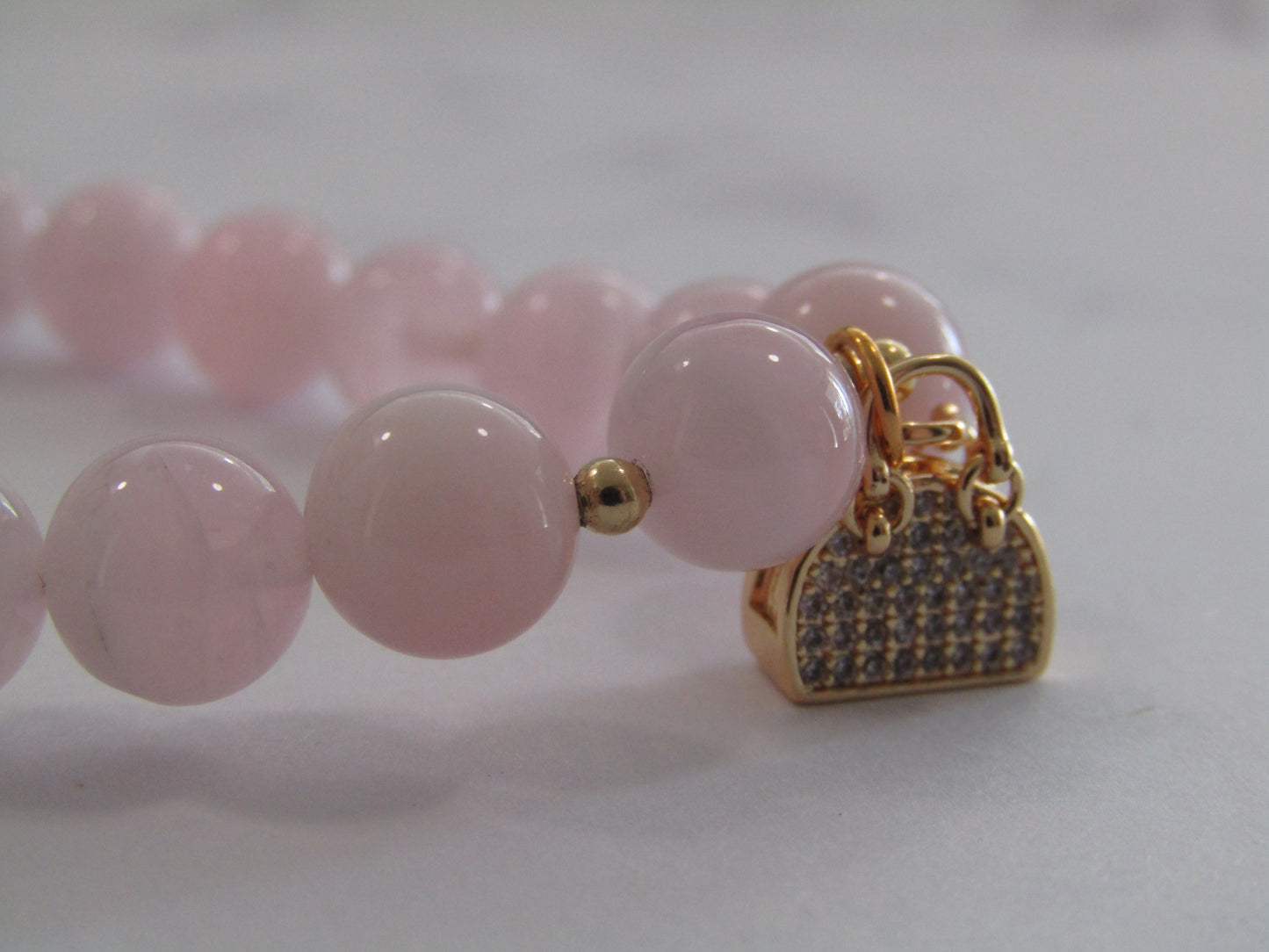 Grade A Madagascar Rose Quartz (8mm) bracelet with 18k gold plated Cubic Zirconia handbag charm