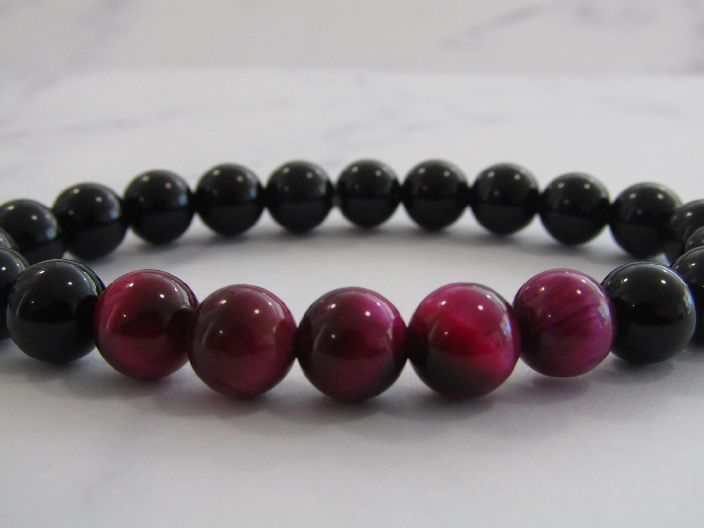 Obsidian bracelet with 5 x Magenta (dyed) Tigers Eye (8mm)