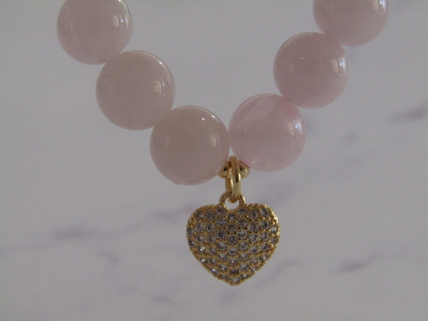 Madagascar Rose Quartz bracelet with 18k gold plated spacer beads and 18k gold plated Cubic Zirconia heart charm - 8mm