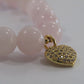 Madagascar Rose Quartz bracelet with 18k gold plated spacer beads and 18k gold plated Cubic Zirconia heart charm - 8mm