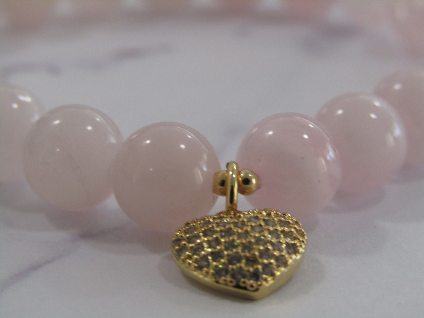 Madagascar Rose Quartz bracelet with 18k gold plated spacer beads and 18k gold plated Cubic Zirconia heart charm - 8mm