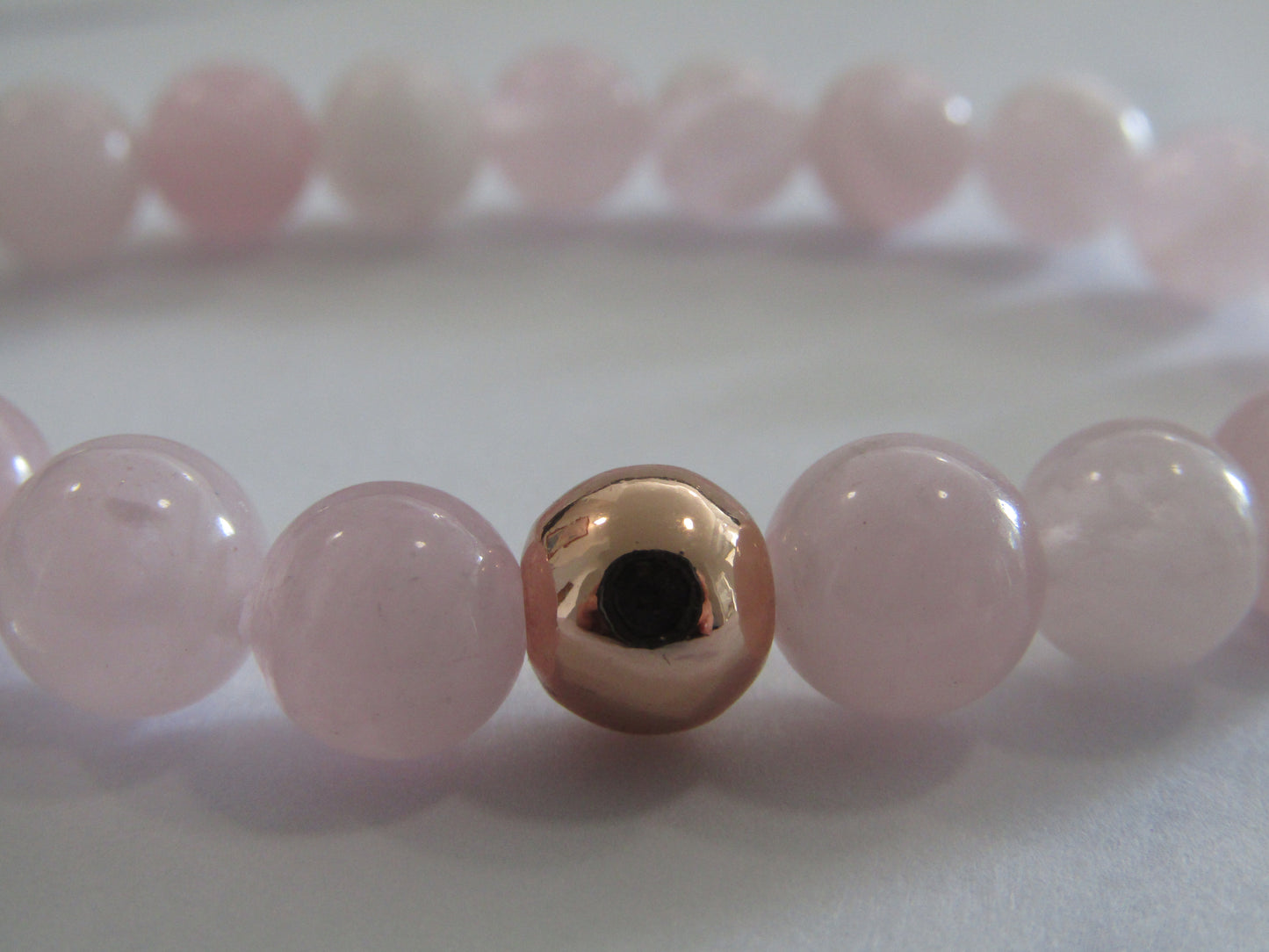 Grade AB Madagascar Rose Quartz with 24k rose gold plated bead