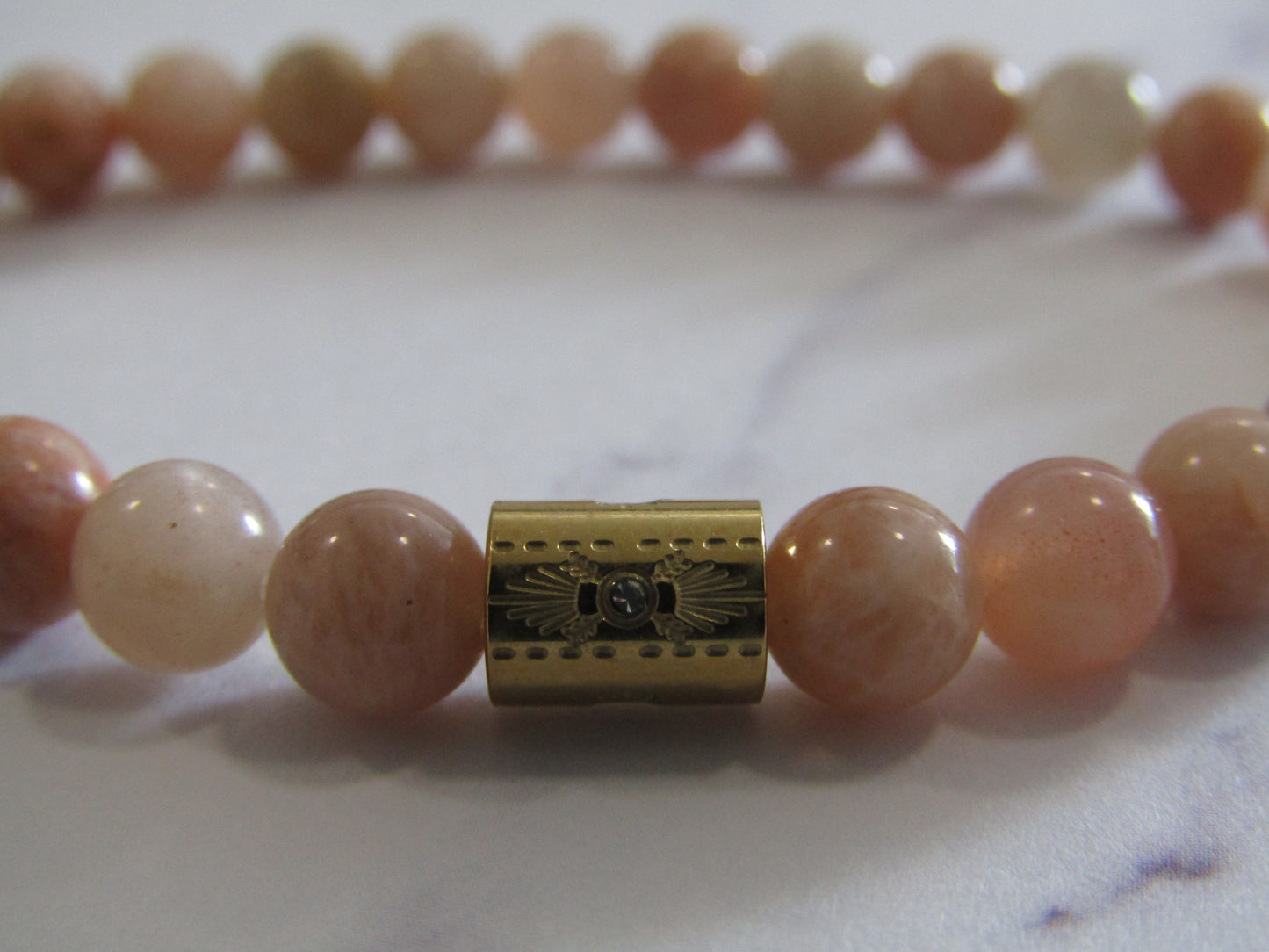 Moonstone and Sunstone bracelet with 18k gold plated Cubic Zirconia bead