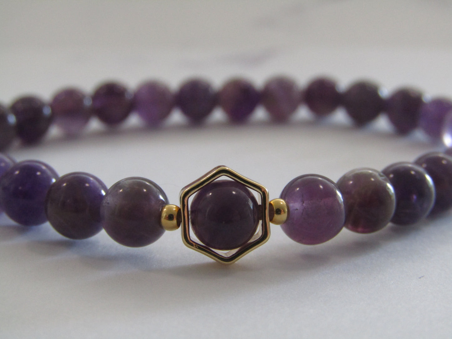 Grade B Amethyst with 18k gold plated hexagon frame