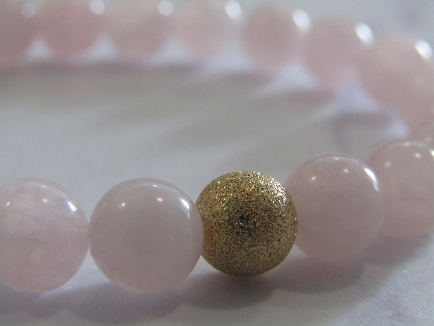 Grade A Madagascar Rose Quartz bracelet with 14k gold filled starburst bead