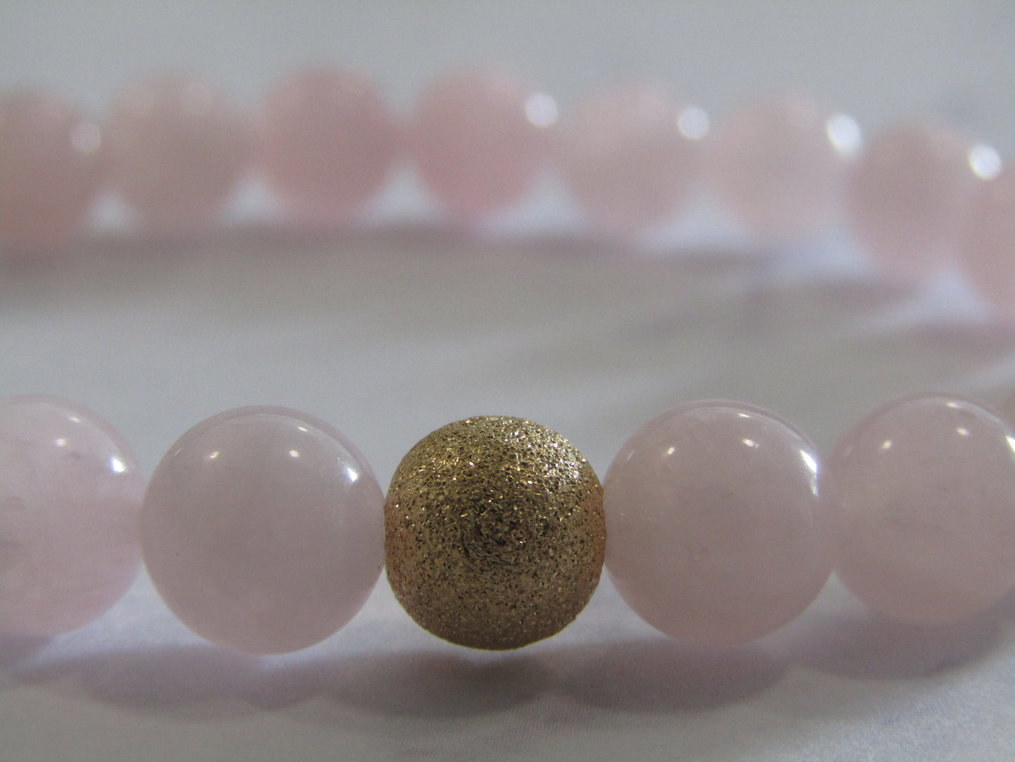 Grade A Madagascar Rose Quartz bracelet with 14k gold filled starburst bead