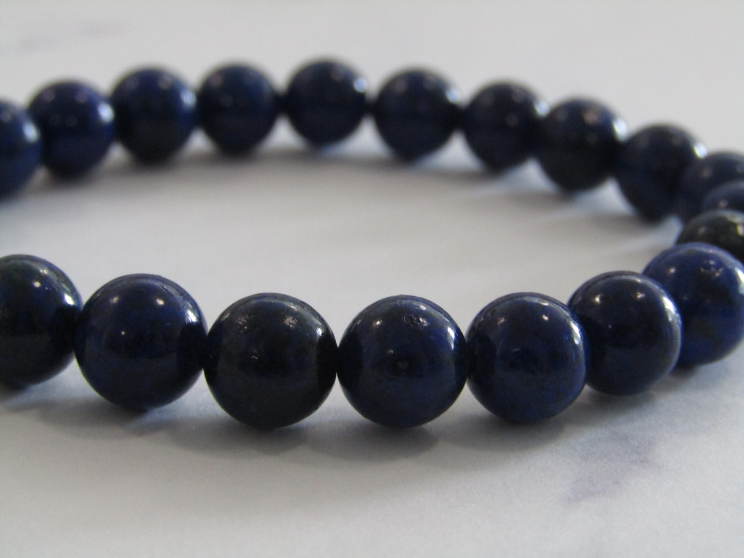 Grade A Lapis Lazuli (8mm) bracelet (filled with gold coloured glue)