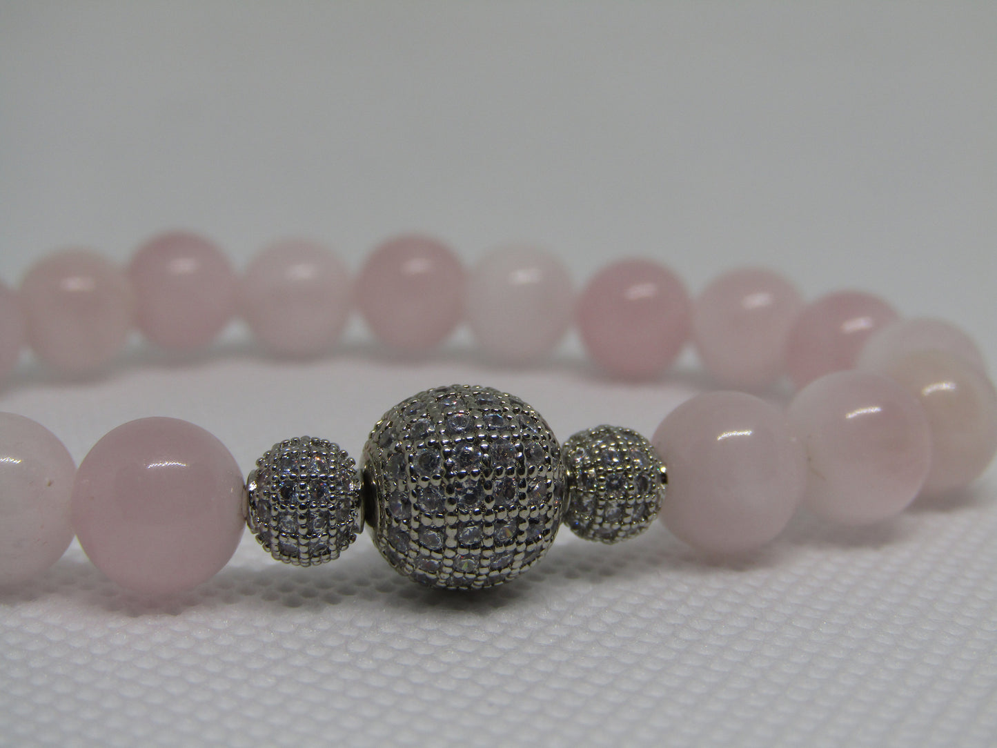 Grade AB Madagascar Rose Quartz bracelet with cubic zirconia silver beads - 8mm