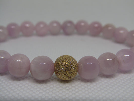 Grade A Kunzite (8mm) bracelet with 14k gold filled starburst bead