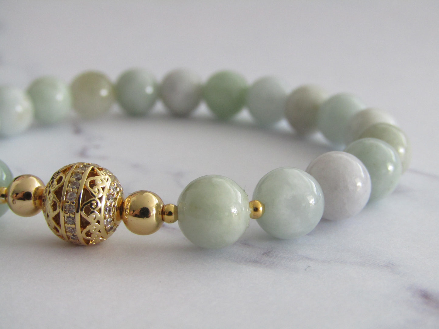 Grade A JADEITE bracelet with 18K gold plated cubic zirconia bead and 18k gold plated spacer beads - 8mm