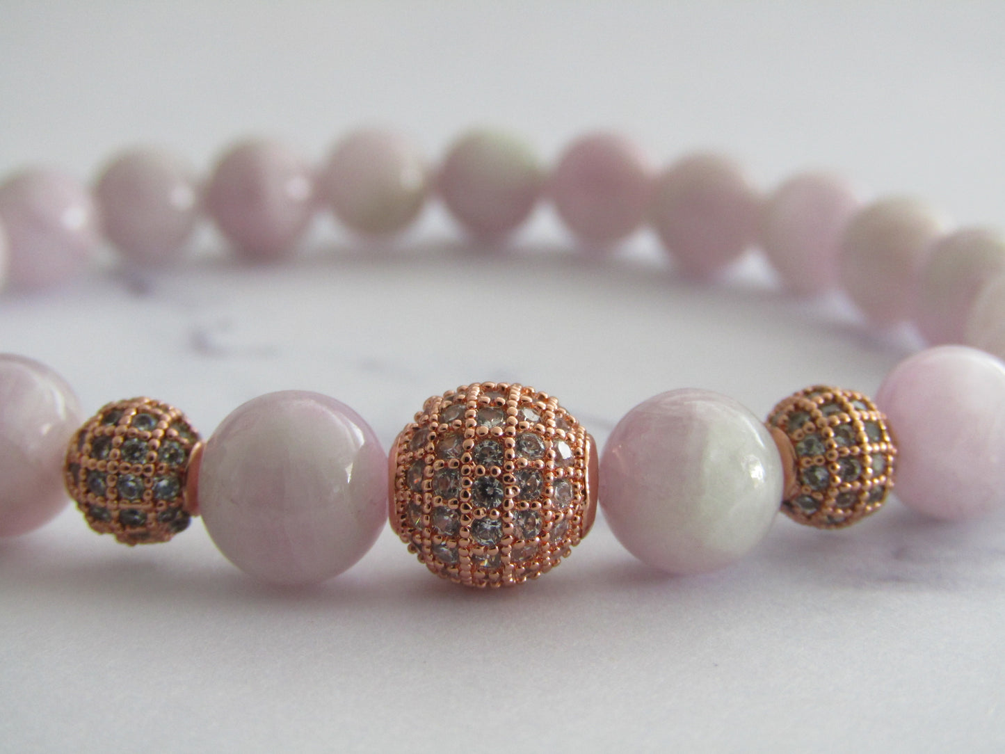 Grade A Kunzite bracelet with 2 x 6mm rose gold cubic zirconia beads and 1 x 8mm rose gold cubic zirconia bead - 8mm