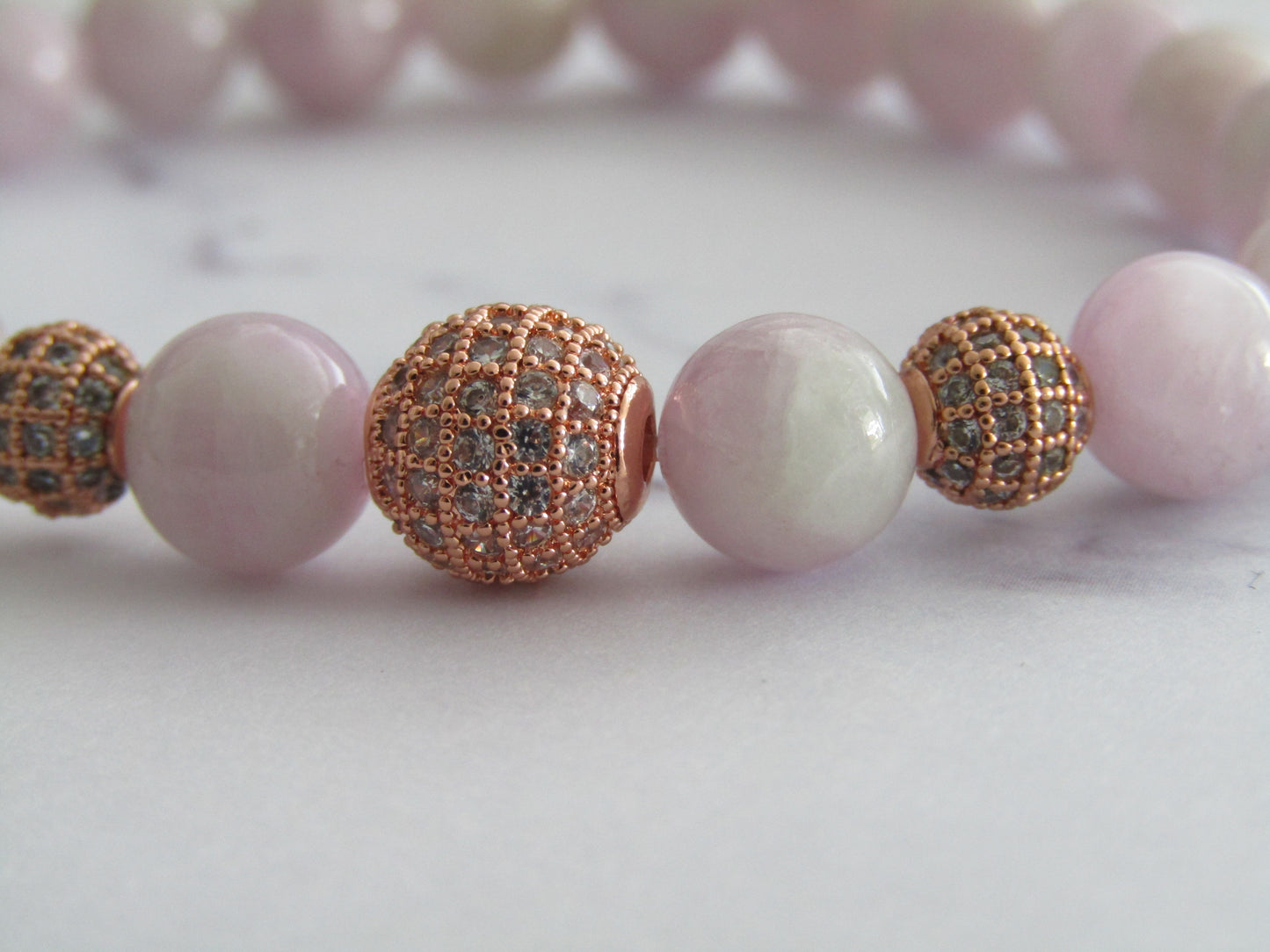 Grade A Kunzite bracelet with 2 x 6mm rose gold cubic zirconia beads and 1 x 8mm rose gold cubic zirconia bead - 8mm