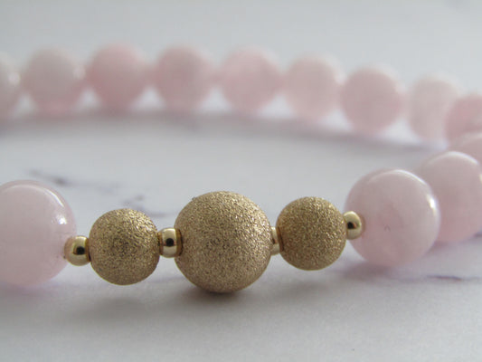 Grade A Madagascar Rose Quartz  bracelet with gold filled starburst beads - 8mm