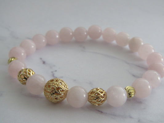 Madagascar Rose Quartz (8mm) bracelet with (5 x) 18k gold plated accentuating beads