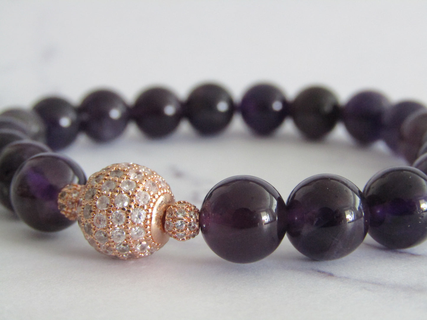 Grade AB Amethyst bracelet with rose gold cubic zirconia beads - 8mm