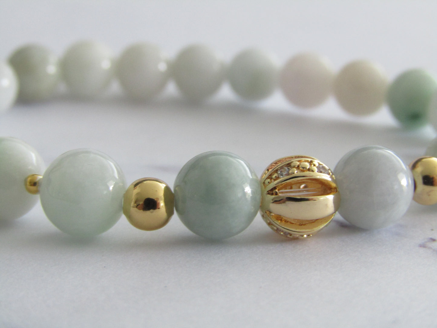 Grade A Jadeite bracelet with 18k gold plated cubic zirconia and 18k gold plated spacer beads - 8mm