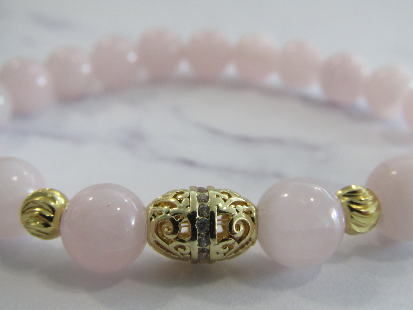 Madagascar Rose Quartz bracelet with 14kt gold plated cubic zirconia bead and 4 x 18k gold plated - 8mm