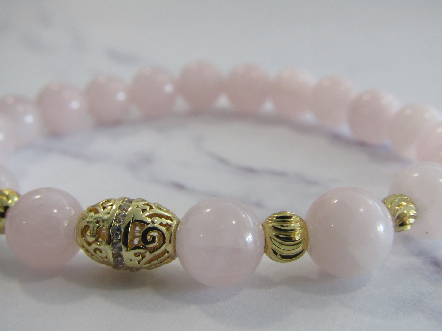 Madagascar Rose Quartz bracelet with 14kt gold plated cubic zirconia bead and 4 x 18k gold plated - 8mm