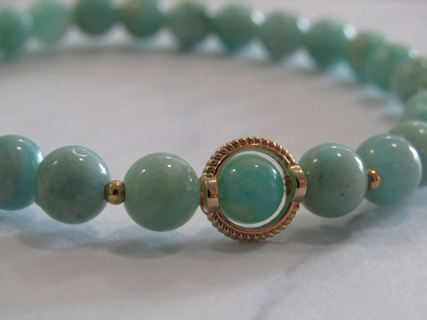 Grade A Amazonite (6mm) bracelet with 18k gold plated frame and spacer beads