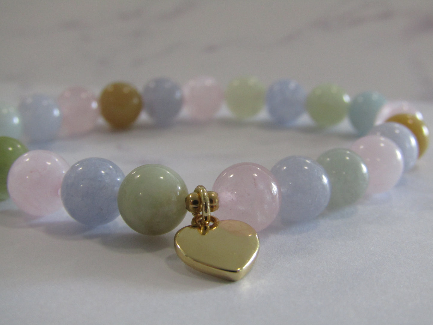 Grade A Morganite (8mm) bracelet with 18k gold heart charm & 24k gold plated spacer beads - 8mm