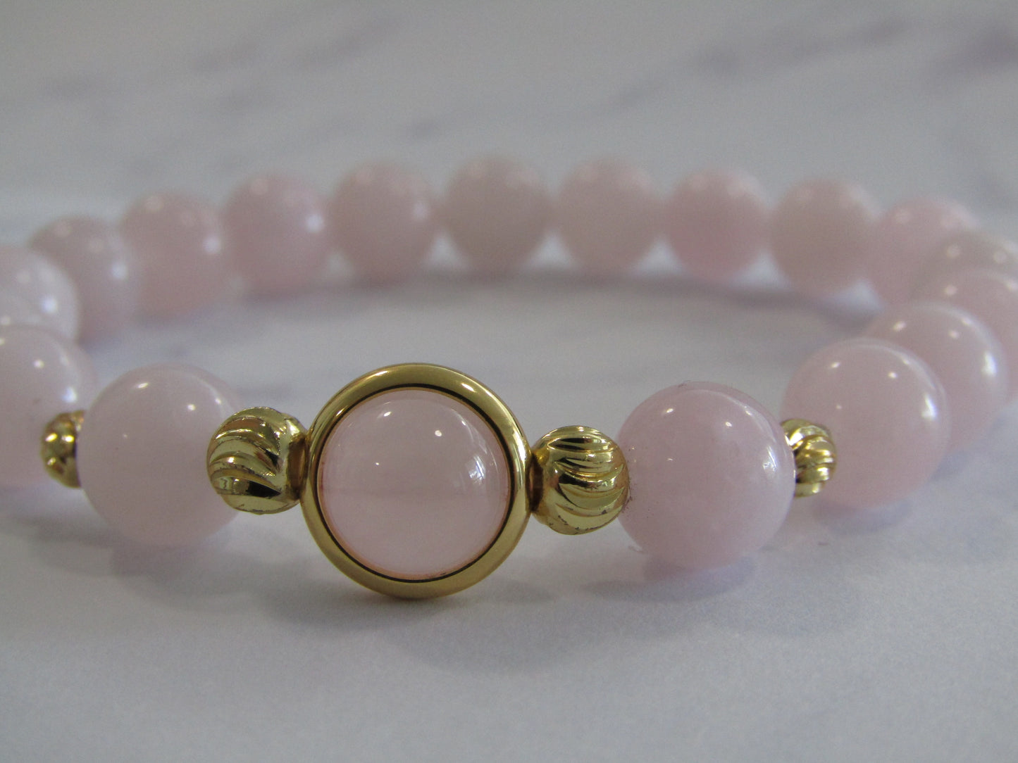 Grade A Rose Quartz (8mm) bracelet with 18k gold plated frame & 14k gold plated beads