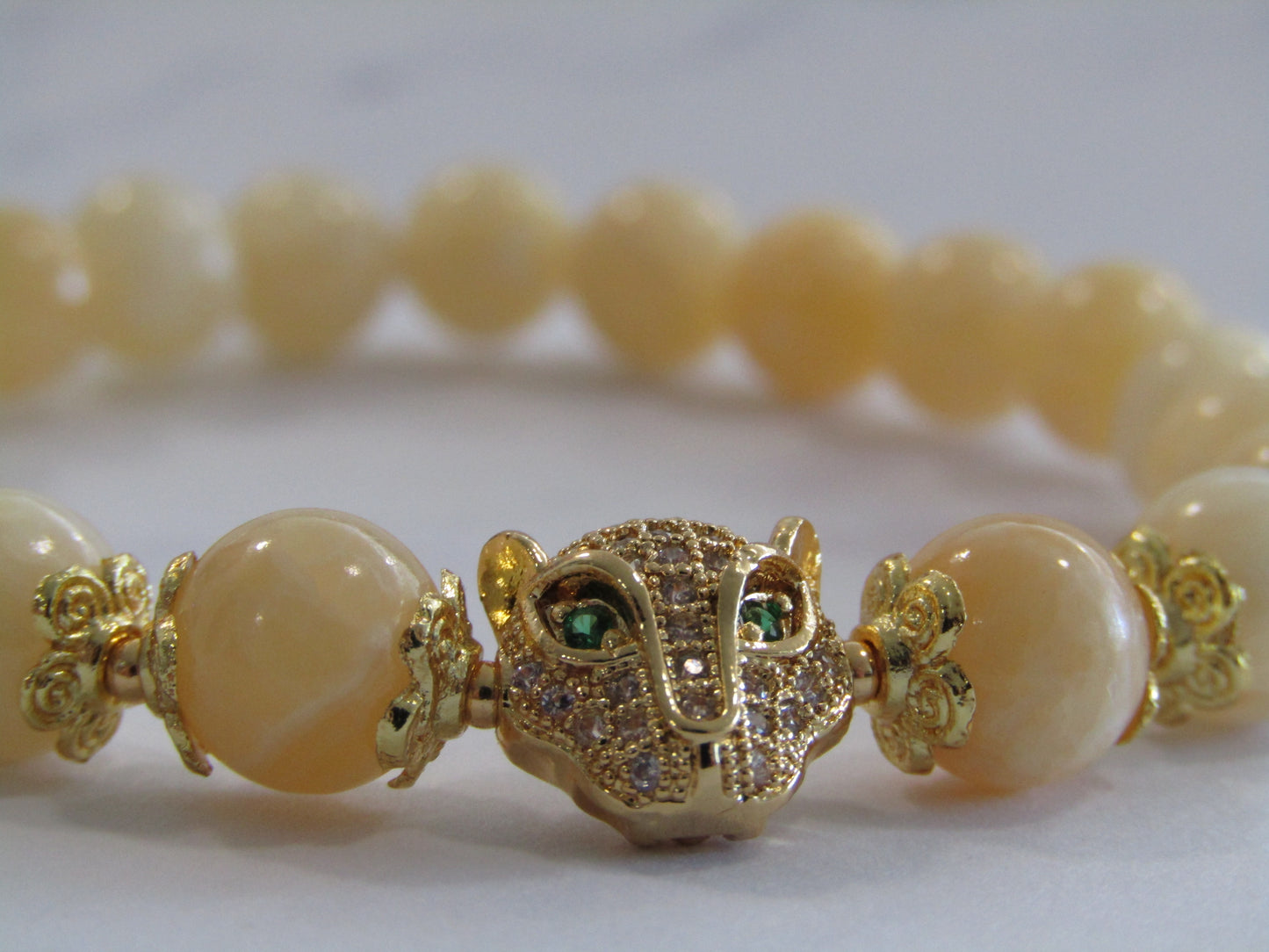 Lemon Jade (8mm) bracelet with 18k gold plated Cubic Zirconia leopard charm and spacer beads