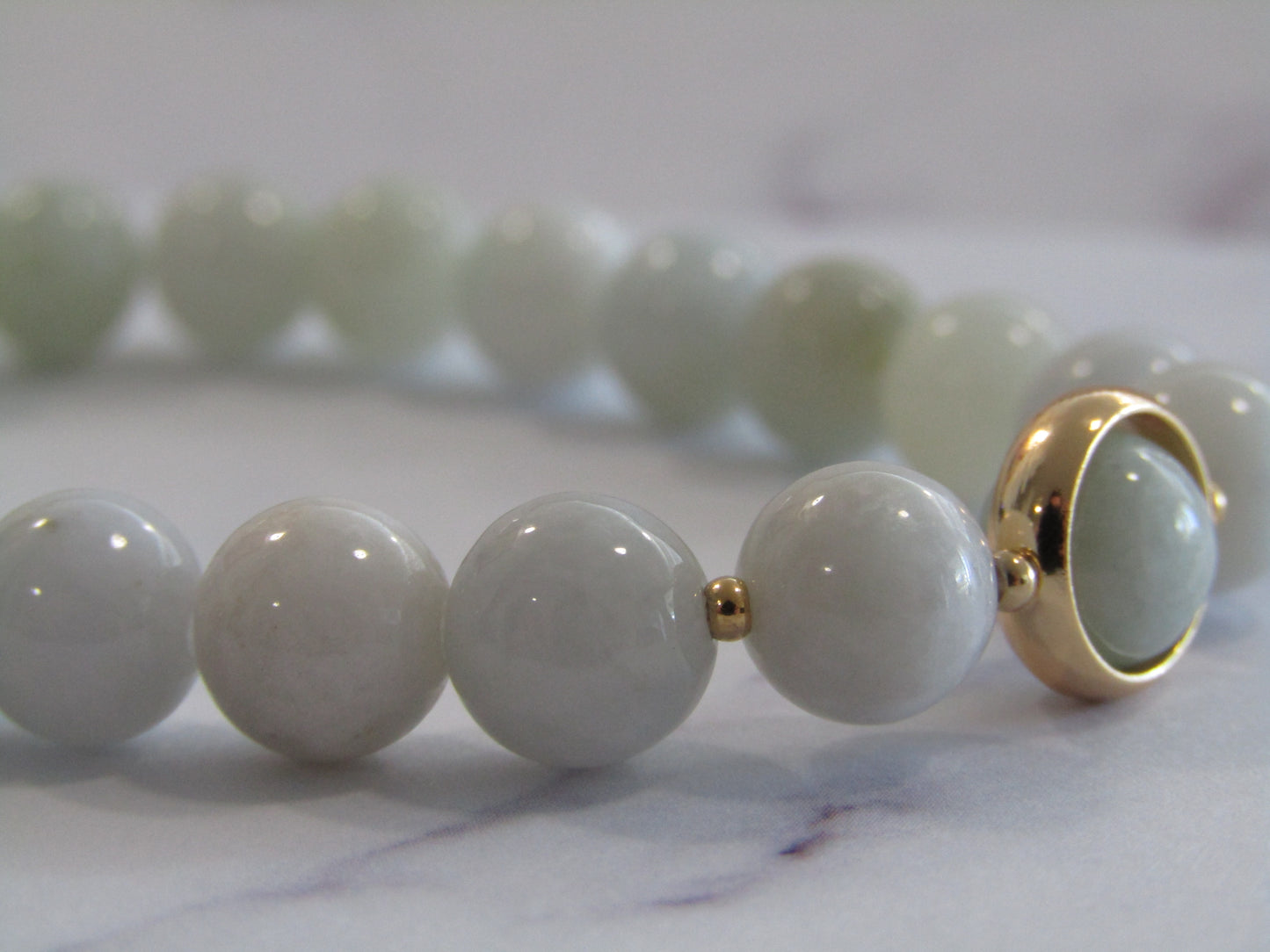 Grade A Jadeite bracelet with 18k gold plated frame and spacer beads