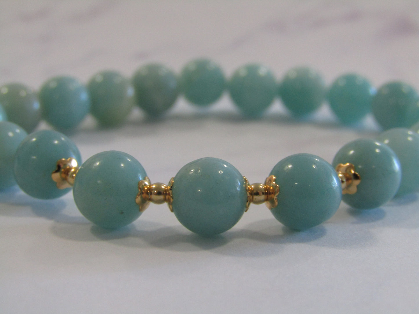 Grade A+ Amazonite bracelet with 18k gold plated caps and 24k gold plated beads