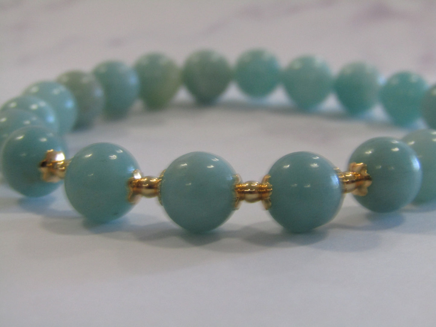 Grade A+ Amazonite bracelet with 18k gold plated caps and 24k gold plated beads