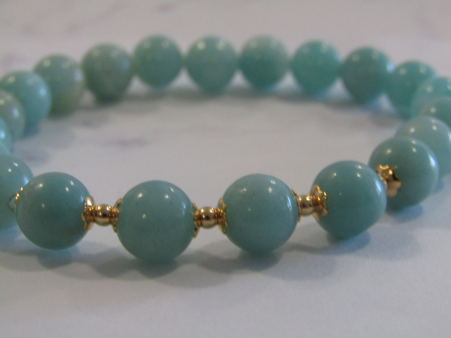 Grade A+ Amazonite bracelet with 18k gold plated caps and 24k gold plated beads