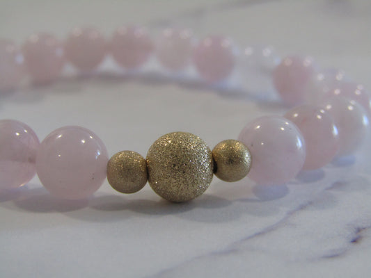 Grade A Madagascar Rose Quartz (8mm) bracelet with 14k gold filled starburst beads