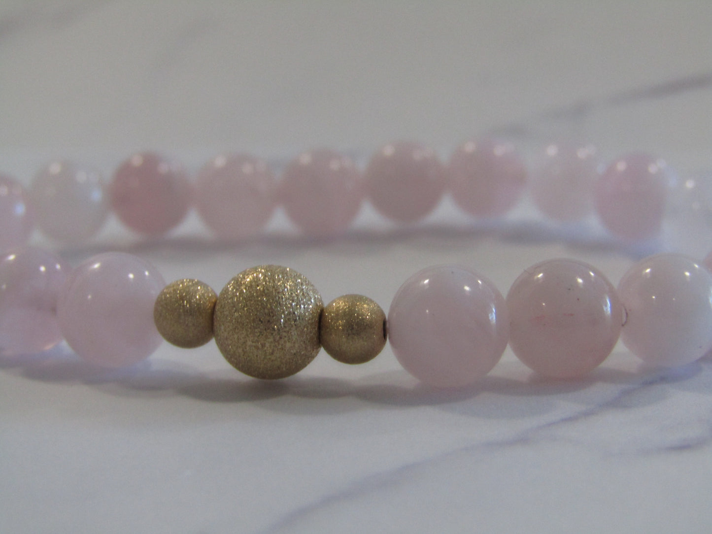 Grade A Madagascar Rose Quartz (8mm) bracelet with 14k gold filled starburst beads